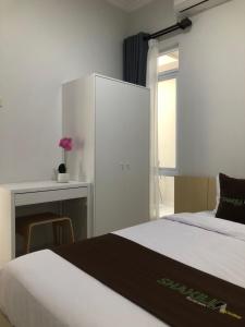 Postel nebo postele na pokoji v ubytování Shakilla House 6C Syariah Cigalumpit Cianjur