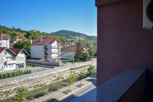 a view of a city with houses and a street at Dvor Lux in Novi Pazar