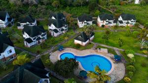 an aerial view of a home with a swimming pool at Diani Blue Water Homes in Kinondo