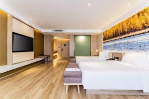 TV a/nebo společenská místnost v ubytování Atour Hotel Hohhot Yinhé South Street