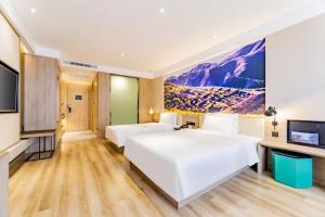 Postel nebo postele na pokoji v ubytování Atour Hotel Hohhot Yinhé South Street