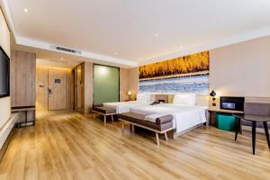 Postel nebo postele na pokoji v ubytování Atour Hotel Hohhot Yinhé South Street