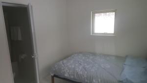 a bedroom with a bed and a window at CLOUD9 - Vacation STAY 46089v in Rusutsu