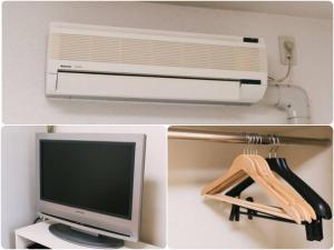 a picture of a computer and a monitor and a telephone at VIEW HAKATA - Vacation STAY 87980 in Fukuoka