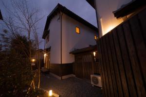 a lit up house with candles in front of it at NAGOMIYA - Vacation STAY 87640 in Yufuin
