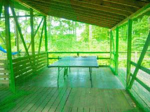 a green bird cage with a table in it at Nasu-gun - House - Vacation STAY 9032 in Anazawa +10 photos