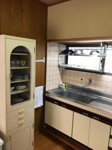 a kitchen with a sink and a counter top at Yufu - House - Vacation STAY 89885 in Yufuin