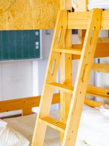 a wooden ladder sitting on top of a bunk bed at Katasyo-Onerabo - Vacation STAY 15734v in Makinohara