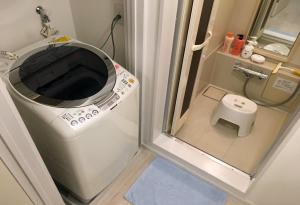 a small bathroom with a washing machine and a toilet at Yokohama - House - Vacation STAY 9002 in Yokohama +48 photos