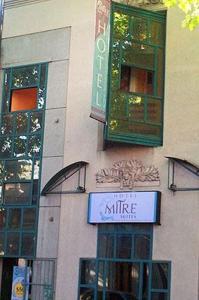 a building with a sign on the side of it at Mitre Suites in Buenos Aires