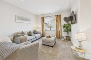 a living room with a couch and a table at Host & Stay - Jomor House in Burnhope