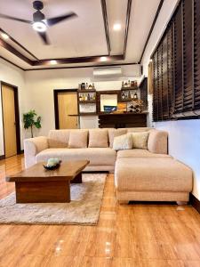 a living room with a couch and a coffee table at Entire Home in Pampanga in San Fernando
