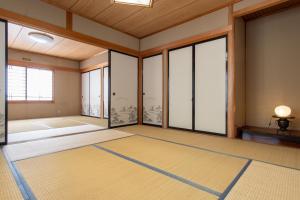 Кровать или кровати в номере Guest house Fujinoyado Akebono - Vacation STAY 92428