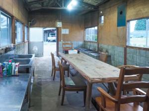 a dining room with a wooden table and chairs at Nakagawa Bettei - Vacation STAY 9303 in Otawara
