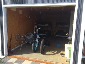 a motorcycle is parked in a garage at Beach Front House Suzuka - Vacation STAY 9364 in Suzuka