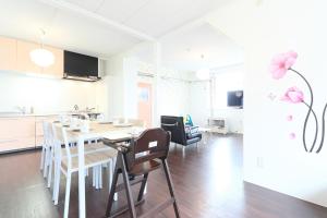 a kitchen and dining room with a table and chairs at Sungarden - Vacation STAY 95967 in Otaru