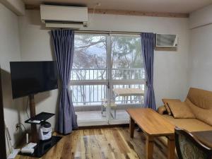 Televisyen dan/atau pusat hiburan di Hakuba Inn Bloom - Vacation STAY 95727 +13 gambar