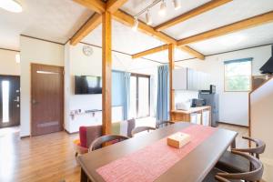 a dining room and kitchen with a table and chairs at Me-fi-You Ishigaki Island - Vacation STAY 95379 in Ishigaki Island
