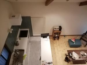an aerial view of an empty living room with a room with a room at c o p s e h a u s-Vacation STAY 97230 in Azumino +2 photos