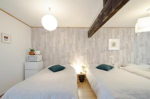 Ένα ή περισσότερα κρεβάτια σε δωμάτιο στο Hakodateyado Mizuki - Vacation STAY 97486