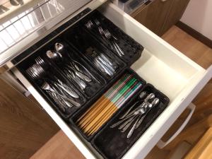 a tray of utensils sitting on top of a stove at Masaru House - Vacation STAY 9439 in Osaka