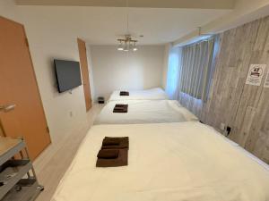 Postel nebo postele na pokoji v ubytování Green House Nakano Fujimicho - Vacation STAY 65988v