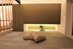 a living room with a couch on the floor at Smart Stay Ito 302 - Vacation STAY 98471 in Ito