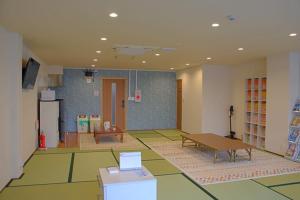 a large room with a table and a table sidx sidx at Guest House Orange no Kaze - Vacation STAY 01298v in Imabari