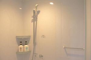 a bathroom with a shower stall and a toilet at Guest House Orange no Kaze - Vacation STAY 01298v in Imabari