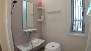 a bathroom with a white toilet and a mirror at Guest House Mulberry - Vacation STAY 9580 in Kirishima +28 photos