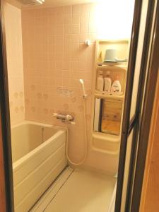 a small bathroom with a tub and a sink at Nasusanso - Vacation STAY 9643 in Nasu-yumoto