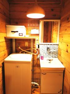 a bathroom with a refrigerator and a sink in a room at Nasusanso - Vacation STAY 9643 in Nasu-yumoto