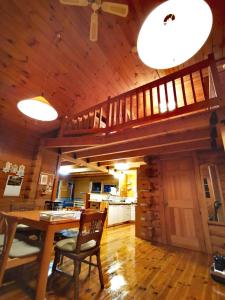 a living room with a table and a wooden ceiling at Nasusanso - Vacation STAY 9643 in Nasu-yumoto