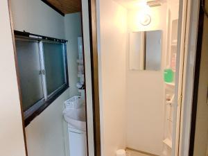 a small bathroom with a toilet and a sink at Osaka - House - Vacation STAY 9690 in Osaka