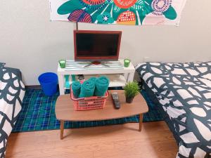 a room with a bed and a table with a computer at Osaka - House - Vacation STAY 9690 in Osaka