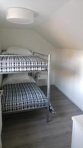 Giường trong phòng chung tại "Gruppenspaß" im schönen Ferienhaus für 10 Personen im Oberharz!