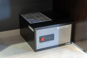 a microwave oven with a box on top of it at Fuchsia - Vacation STAY 78249v in Nagoya