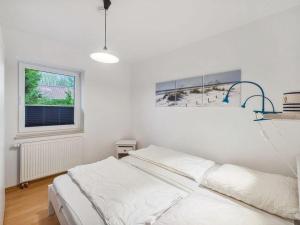 Ένα ή περισσότερα κρεβάτια σε δωμάτιο στο Ferienhaus Birkenlund