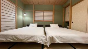 Ένα ή περισσότερα κρεβάτια σε δωμάτιο στο Forest House -Shinka- - Vacation STAY 10539v