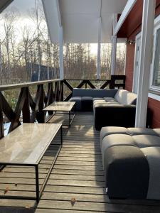 a room with couches and tables on a balcony at KAMMA - Vacation STAY 12882v in Kutchan