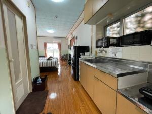 Kuchyň nebo kuchyňský kout v ubytování NAGO Sakura Resort Inn - Vacation STAY 14448v