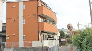 a building with a clock on the side of it at Credo Maison Kamakura - Vacation STAY 10347 in Kamakura