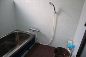 a bathroom with a shower with a tub and a sink at Oyado Endo - Vacation STAY 12914v in Sanuki +11 photos