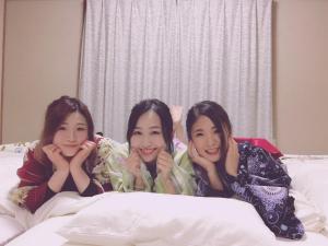 three women laying on a bed in a bedroom at Oyado Endo - Vacation STAY 12914v in Sanuki