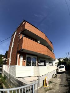 a house that is sitting on top of a fence at Credo Maison Kamakura - Vacation STAY 10395 in Kamakura