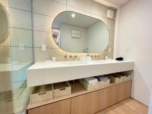 a bathroom with a sink and a mirror at Karuizawa House Villa - Vacation STAY 08359v in Oiwake +9 photos