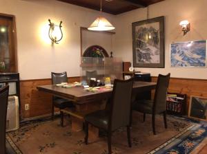 a dining room with a wooden table and chairs at New Togakushi Sea Hail - Vacation STAY 61073v in Nagano