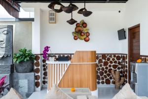 a room with a counter with fruit on the wall at Mahayani Ubud Villa in Tegalalang
