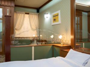 a bedroom with a bed and a sink and a window at Farm Garden Hotel in Numazu +176 photos