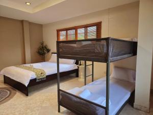 Katil atau katil-katil dalam bilik di Relax Inn DMK